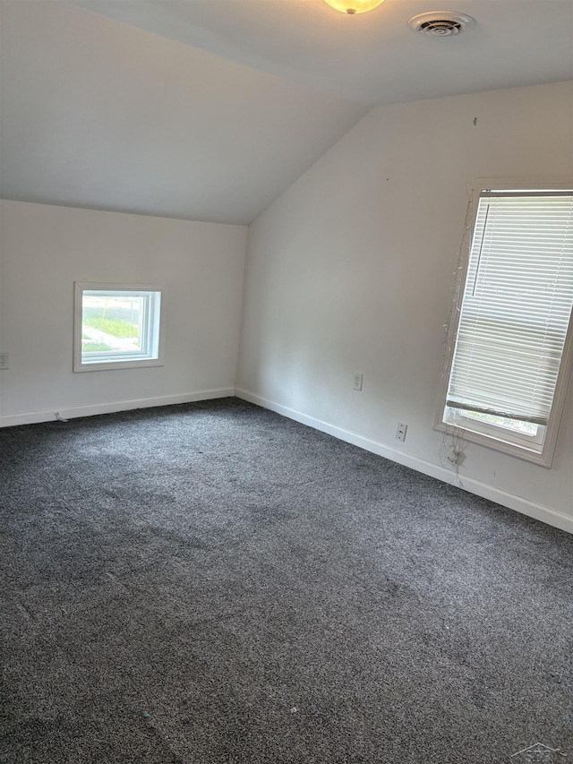 2024 Cooper Ave, Saginaw, MI 48602 - additional living space featuring vaulted ceiling and dark carpet