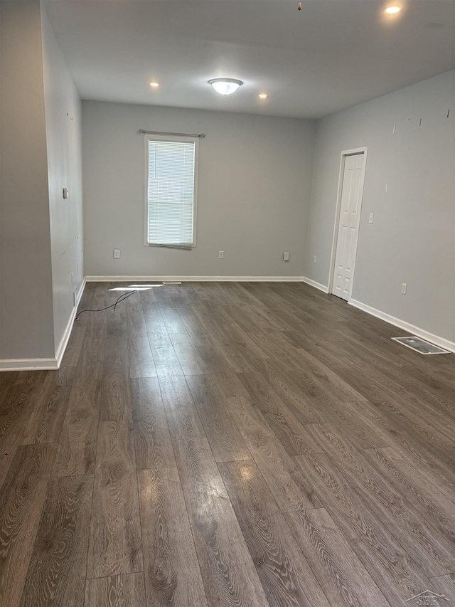 2024 Cooper Ave, Saginaw, MI 48602 - spare room with dark wood-type flooring and recessed lighting