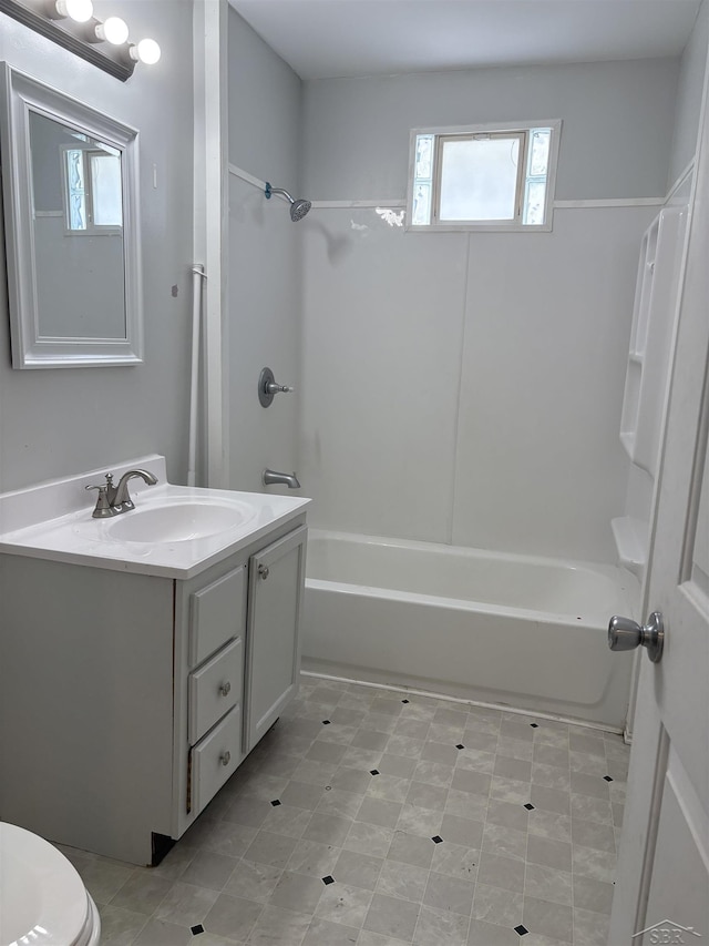 2024 Cooper Ave, Saginaw, MI 48602 - bathroom with plenty of natural light, vanity, and bathtub / shower combination