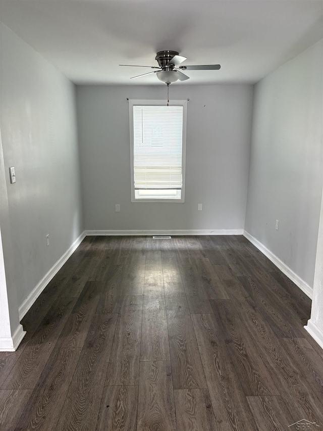 2024 Cooper Ave, Saginaw, MI 48602 - empty room with ceiling fan and dark wood-type flooring
