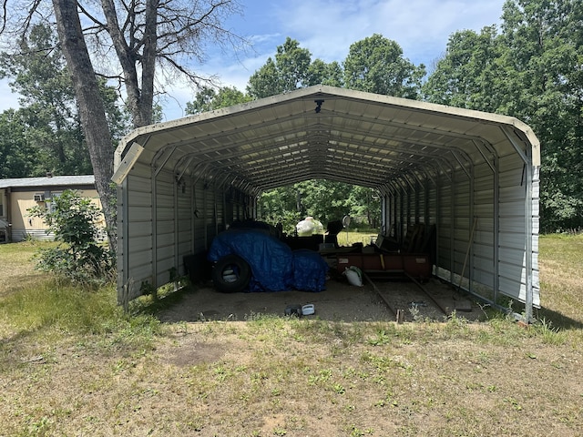 3245 W Leisura Loop, Baldwin, MI 49304 - view of car parking with a carport