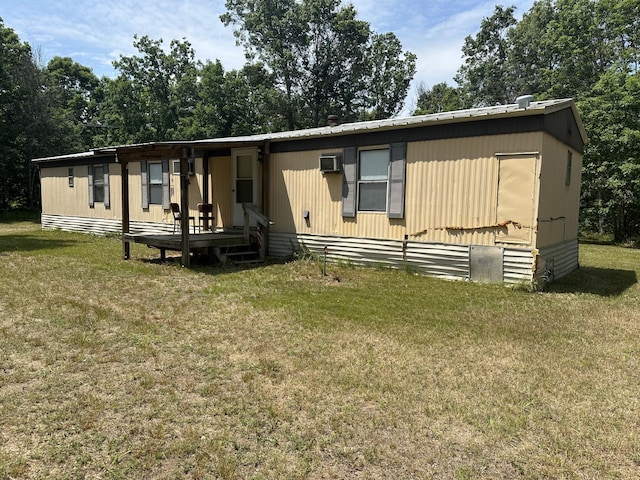 3245 W Leisura Loop, Baldwin, MI 49304 - manufactured / mobile home with a front lawn and a metal roof