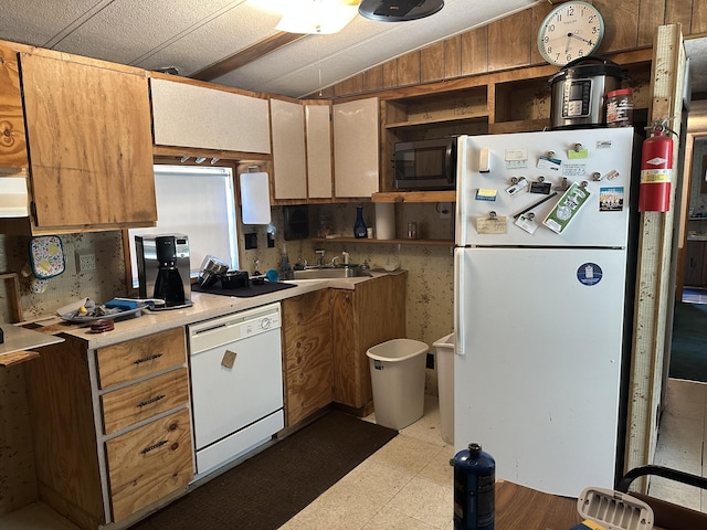 3245 W Leisura Loop, Baldwin, MI 49304 - kitchen featuring white appliances, dark flooring, open shelves, light countertops, and lofted ceiling
