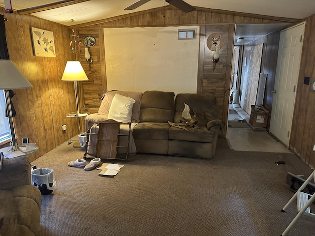 3245 W Leisura Loop, Baldwin, MI 49304 - carpeted living area featuring wood walls, vaulted ceiling, and ceiling fan