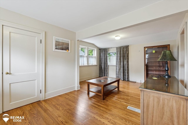 616 S Warren Ave, Saginaw, MI 48607 - living room with light wood-style floors and vaulted ceiling