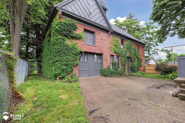 616 S Warren Ave, Saginaw, MI 48607 - view of home's exterior featuring brick siding