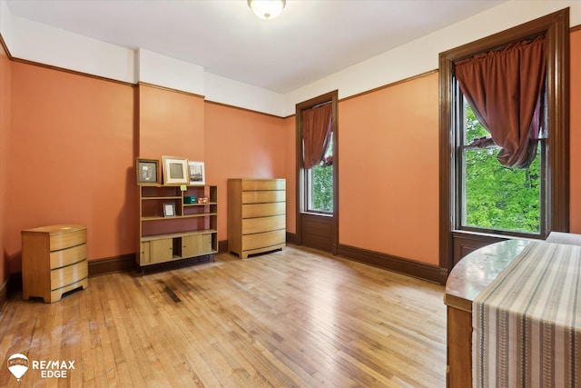 616 S Warren Ave, Saginaw, MI 48607 - unfurnished bedroom with light wood-type flooring