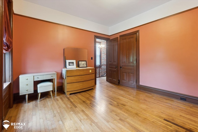 616 S Warren Ave, Saginaw, MI 48607 - bedroom with light wood-style flooring