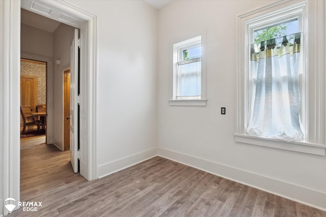 616 S Warren Ave, Saginaw, MI 48607 - empty room featuring healthy amount of natural light and light wood-style flooring