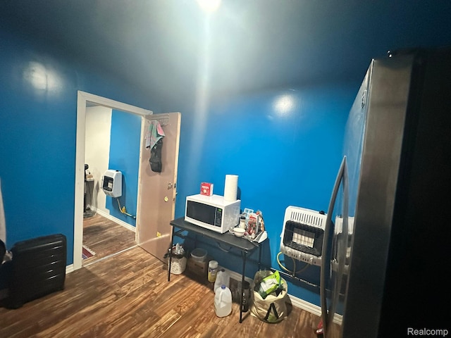 3875 Sobieski St, Hamtramck, MI 48212 - misc room with heating unit and wood finished floors