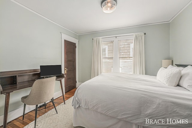 1035 Fountain St NE, Grand Rapids, MI 49503 - bedroom featuring crown molding, wood finished floors, and a desk