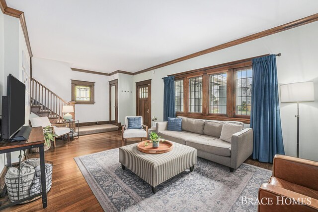 1035 Fountain St NE, Grand Rapids, MI 49503 - living room with stairway, wood finished floors, and ornamental molding