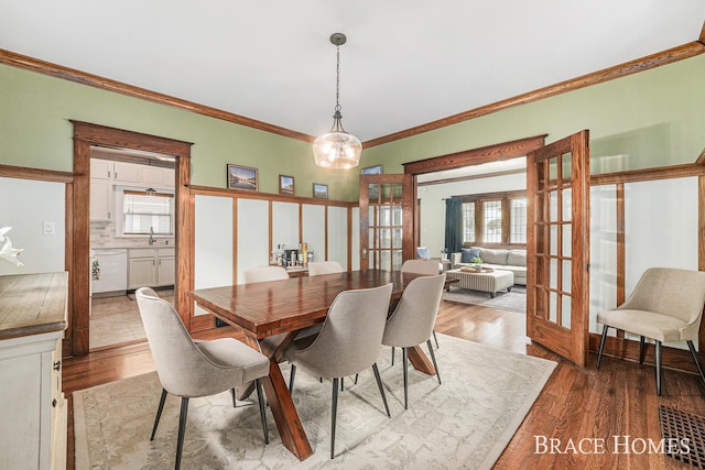 1035 Fountain St NE, Grand Rapids, MI 49503 - dining area with french doors, plenty of natural light, wood finished floors, and ornamental molding