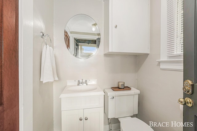 1035 Fountain St NE, Grand Rapids, MI 49503 - bathroom featuring toilet and vanity