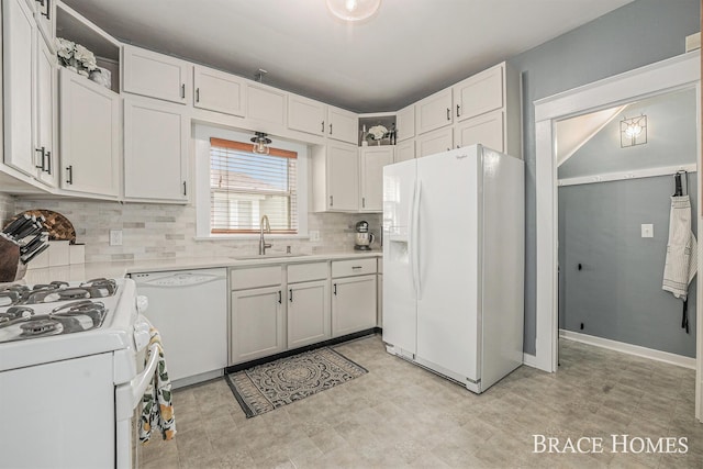 1035 Fountain St NE, Grand Rapids, MI 49503 - kitchen featuring white appliances, light countertops, decorative backsplash, white cabinetry, and open shelves