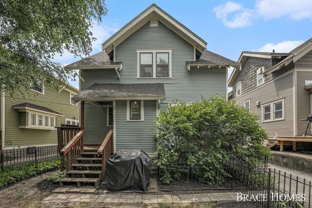 1035 Fountain St NE, Grand Rapids, MI 49503 - rear view of property with roof with shingles