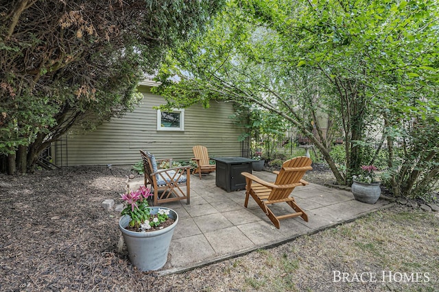 1035 Fountain St NE, Grand Rapids, MI 49503 - view of patio featuring an outdoor fire pit