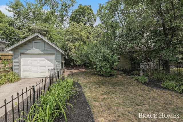 1035 Fountain St NE, Grand Rapids, MI 49503 - view of yard with a detached garage, an outdoor structure, and concrete driveway