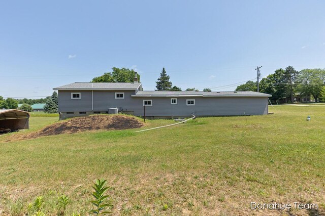 4875 Ferris Ave, Newaygo, MI 49337 - back of house featuring a lawn