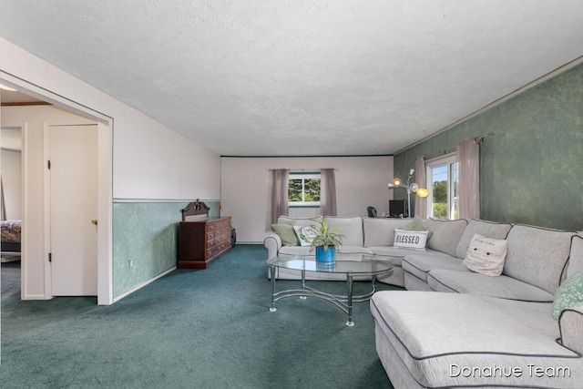 4875 Ferris Ave, Newaygo, MI 49337 - carpeted living area featuring a textured ceiling and baseboards