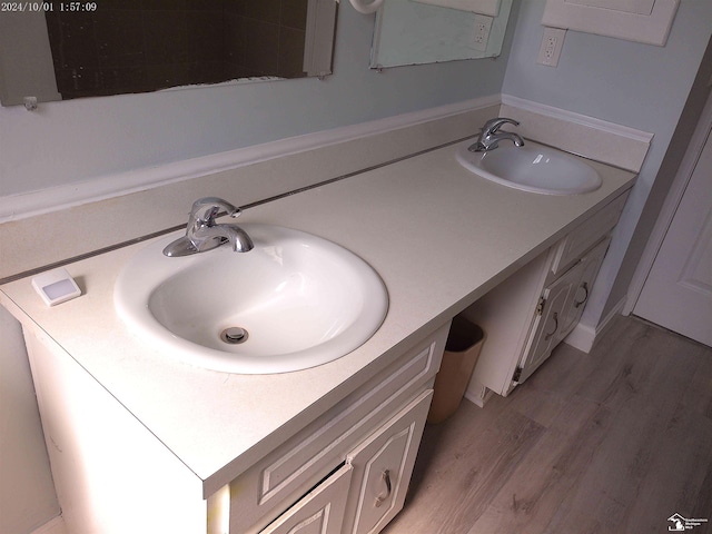27354 Oakcrest Dr, Brownstown, MI 48183 - bathroom featuring double vanity and wood finished floors