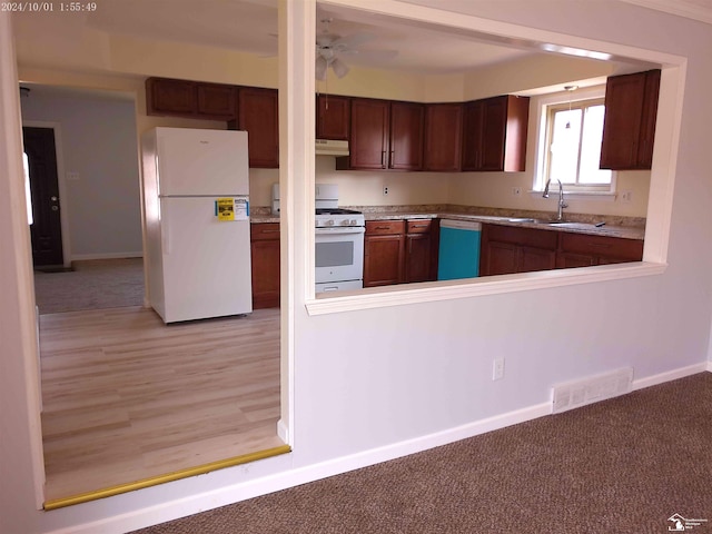 27354 Oakcrest Dr, Brownstown, MI 48183 - kitchen with white appliances, under cabinet range hood, light countertops, and ceiling fan