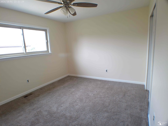 27354 Oakcrest Dr, Brownstown, MI 48183 - carpeted empty room with a ceiling fan and baseboards