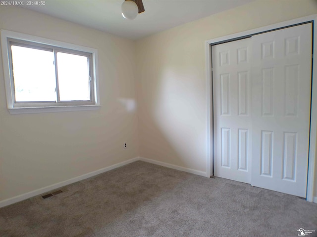 27354 Oakcrest Dr, Brownstown, MI 48183 - unfurnished bedroom featuring carpet and a closet