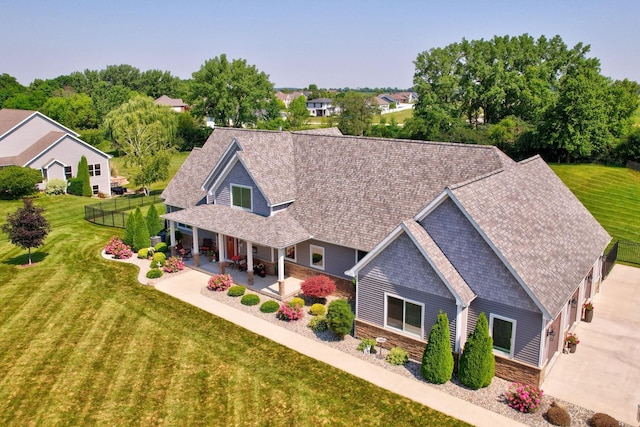 12529 E Tuscola Rd, Frankenmuth, MI 48734 - view of front of property featuring stone siding, roof with shingles, and a porch