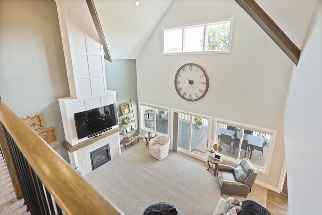 12529 E Tuscola Rd, Frankenmuth, MI 48734 - living area featuring high vaulted ceiling, a fireplace, and carpet floors