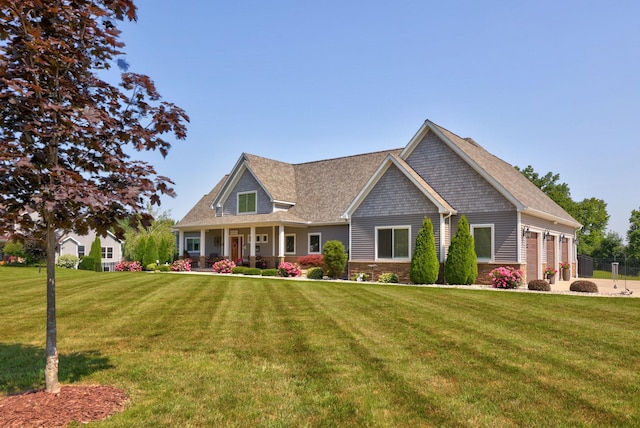 12529 E Tuscola Rd, Frankenmuth, MI 48734 - view of front of home with a front lawn, a garage, and covered porch