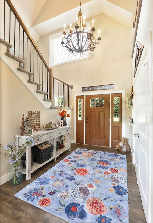 12529 E Tuscola Rd, Frankenmuth, MI 48734 - entrance foyer featuring a chandelier, plenty of natural light, high vaulted ceiling, and dark wood-type flooring
