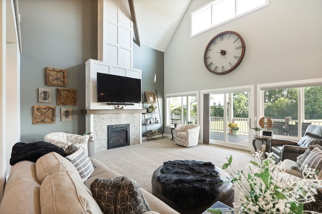 12529 E Tuscola Rd, Frankenmuth, MI 48734 - living area with high vaulted ceiling, carpet, a fireplace, and plenty of natural light