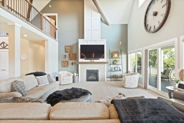 12529 E Tuscola Rd, Frankenmuth, MI 48734 - carpeted living area featuring high vaulted ceiling and a tiled fireplace