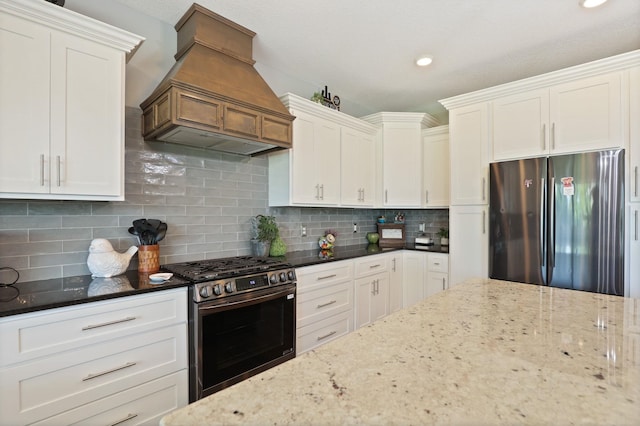 12529 E Tuscola Rd, Frankenmuth, MI 48734 - kitchen featuring appliances with stainless steel finishes, custom exhaust hood, dark stone counters, white cabinetry, and recessed lighting