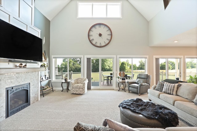 12529 E Tuscola Rd, Frankenmuth, MI 48734 - living area with high vaulted ceiling, carpet floors, and a fireplace