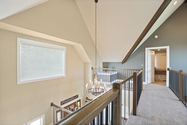 12529 E Tuscola Rd, Frankenmuth, MI 48734 - hall with an upstairs landing, high vaulted ceiling, a chandelier, and carpet floors