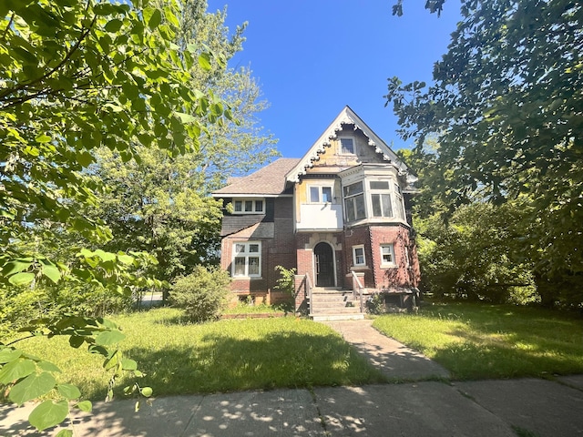 205 Alger St, Detroit, MI 48202 - view of front of home featuring brick siding and a front yard
