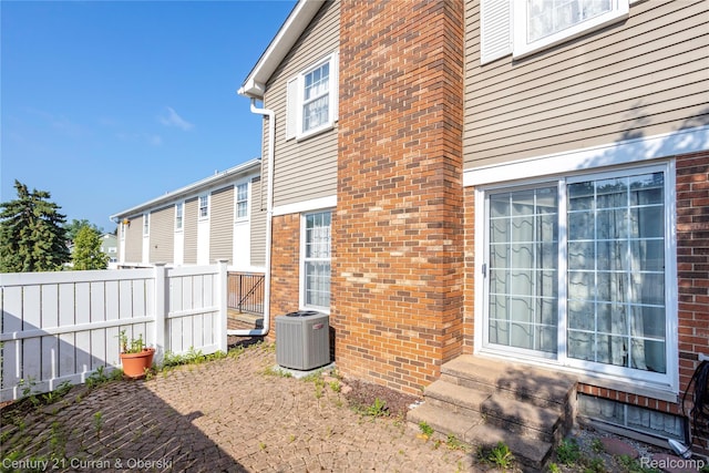 20918 W Glen Haven Cir, Novi, MI 48167 - view of side of home featuring brick siding and entry steps