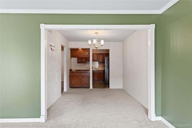 20918 W Glen Haven Cir, Novi, MI 48167 - kitchen featuring a chandelier, light carpet, freestanding refrigerator, brown cabinetry, and decorative light fixtures