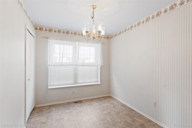 20918 W Glen Haven Cir, Novi, MI 48167 - empty room with a chandelier, tile patterned floors, and wallpapered walls