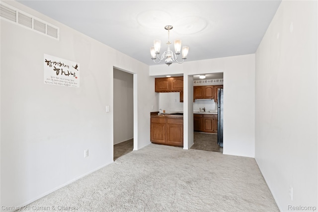 20918 W Glen Haven Cir, Novi, MI 48167 - unfurnished dining area featuring a chandelier and light carpet