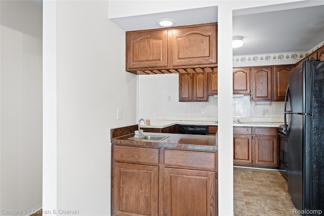 20918 W Glen Haven Cir, Novi, MI 48167 - kitchen featuring black appliances, brown cabinetry, and backsplash