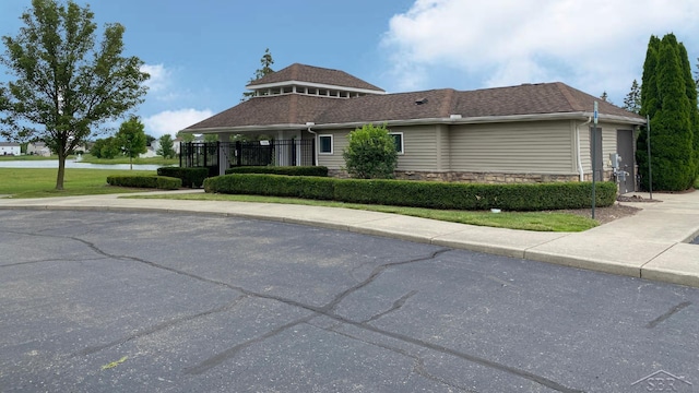3244 Pine Run Dr, Swartz Creek, MI 48473 - view of side of property featuring stone siding