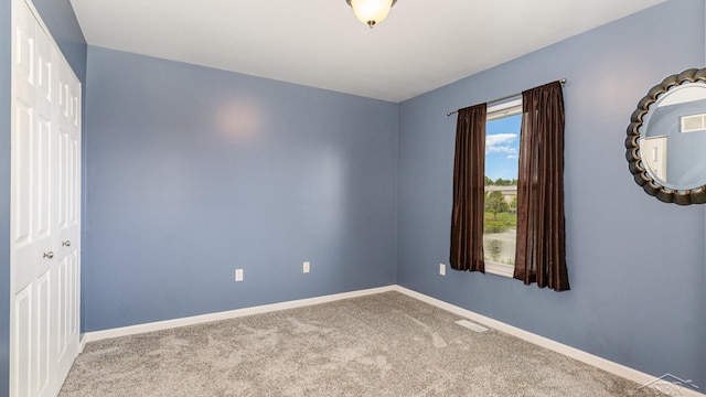 3244 Pine Run Dr, Swartz Creek, MI 48473 - empty room featuring carpet flooring and baseboards