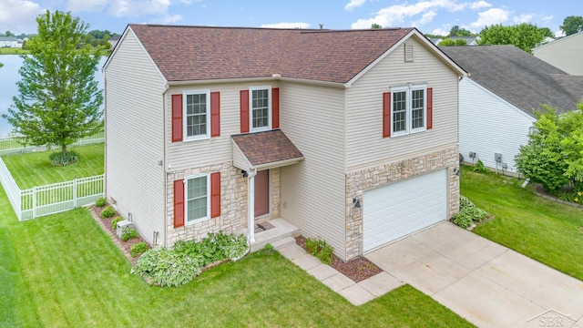 3244 Pine Run Dr, Swartz Creek, MI 48473 - view of front of property featuring stone siding, roof with shingles, driveway, and a garage