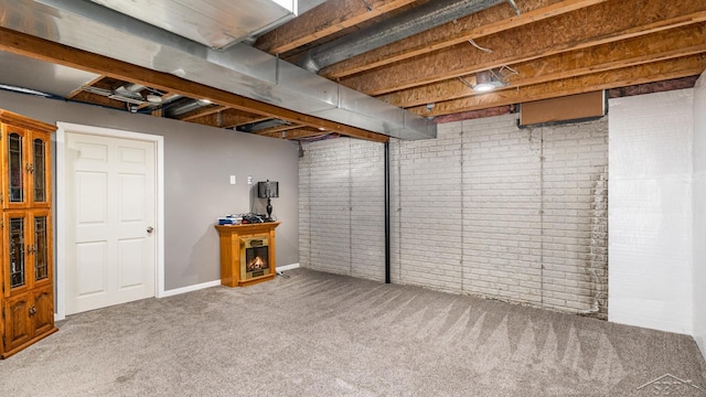 3244 Pine Run Dr, Swartz Creek, MI 48473 - below grade area with carpet floors and brick wall