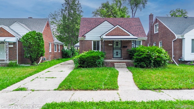 20510 Rosemont Ave, Detroit, MI 48219 - bungalow featuring brick siding, a front lawn, and a shingled roof
