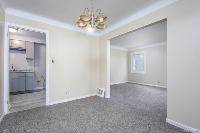 20510 Rosemont Ave, Detroit, MI 48219 - spare room with a chandelier and light carpet