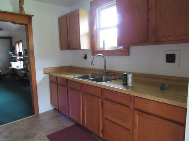 3105 N 26th St, Kalamazoo, MI 49048 - kitchen featuring brown cabinetry and light countertops